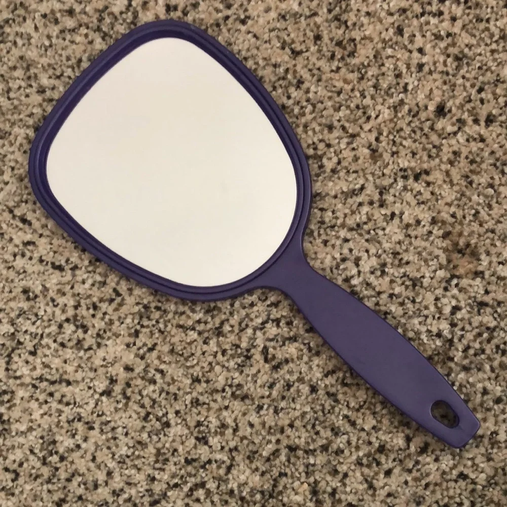 Three hand held mirrors. Good condition. The blue and the green one are vintage